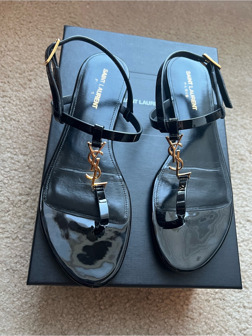 Saint Laurent Cassandra Black Patent Leather gold Logo Toe-Post Sandals